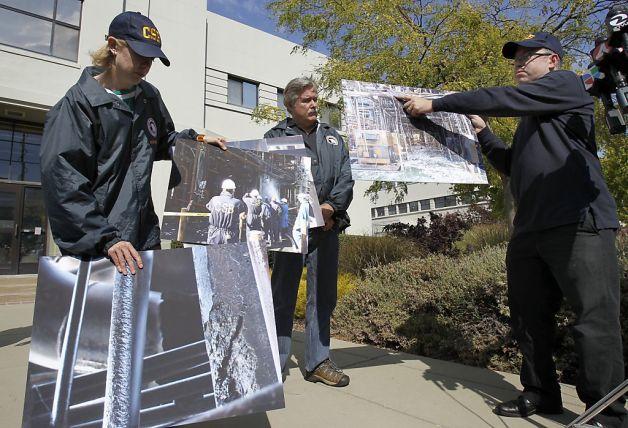 Members of the Chemical Safety Board juggle photographs of the scene of the scene outside Chevron. Investigators from the federal Chemical Safety and Hazard Investigation Board discussed their early findings into the fire at the Chevron refinery in Richmond, Calif. Tuesday August 14, 2012. Photo: Brant Ward, The Chronicle / SF